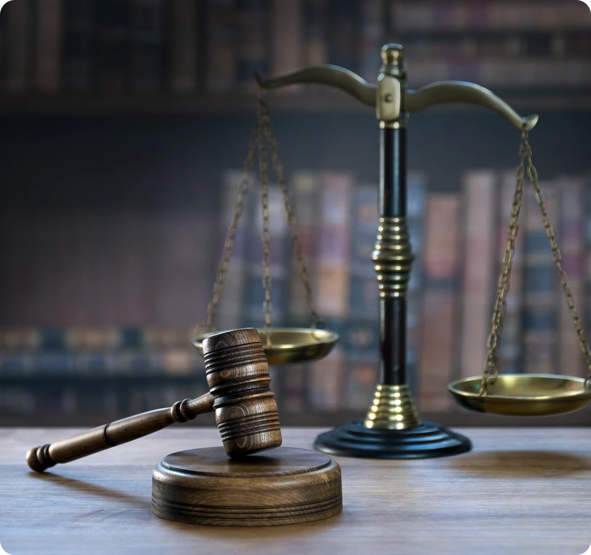 Gavel and scales of justice on table.