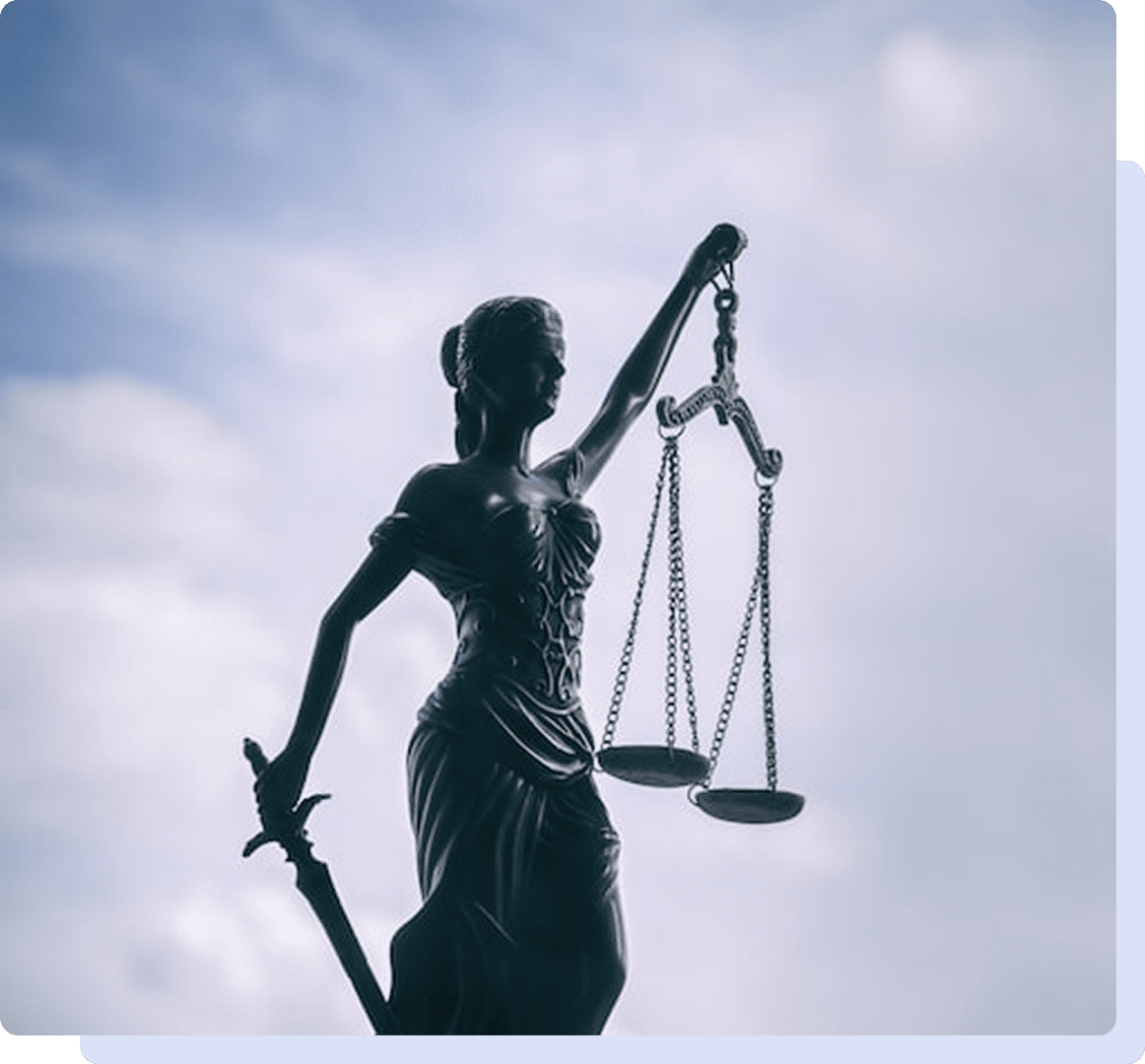 Lady Justice statue with scales and sword.