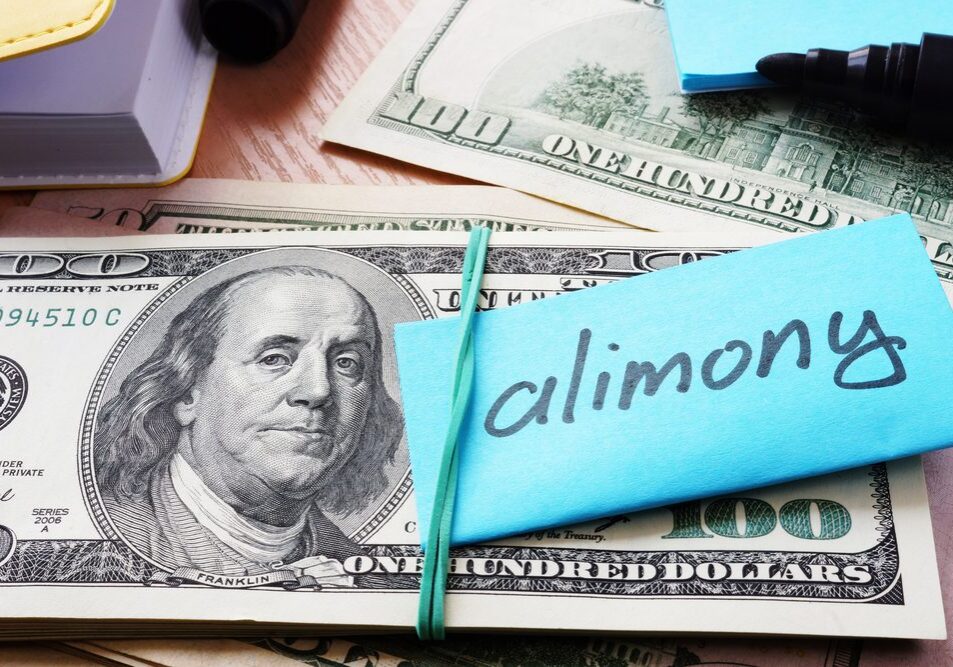 Cash bundle labeled "alimony" with rubber band.